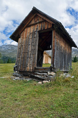 Fototapeta na wymiar old and new barn in the mountain