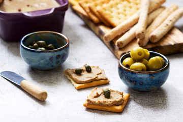 Chicken liver, onion and carrot paste, served with crackers, grissini, olives, capers and champagne.
