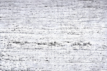 The concrete wall is white with black scratches and black veins located horizontally. Concept for...