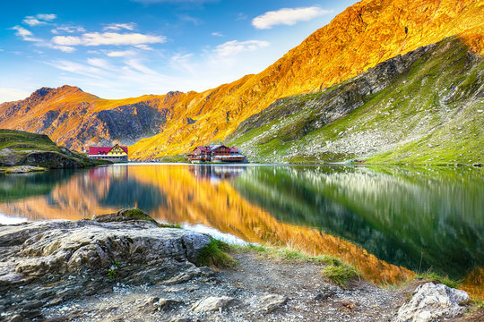 Majestic sunset view of Balea glacier lake near the Transfagarasan road.