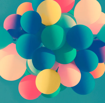 Colorful balloons on a blue sky - vintage style