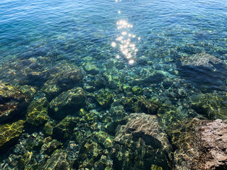 Sun glare on the sea surface, natural colors of the sea water, background