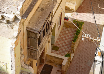 Aerial view of building just prior to being demolished for redevelopment as a new block of apartments in Sliema, Malta