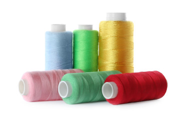 Set of color sewing threads isolated on white