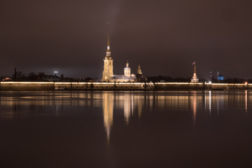 Fototapeta na wymiar Peter and Paul Fortress and the Neva River decorated for Christmas. Petersburg eve of the new year. Winter night Russia.