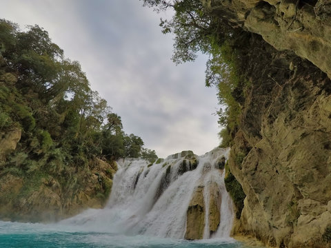 yellow boat point of view (EL SALTO-EL MECO) san luis potosi México, hermosa cascada Turquoise water in a river and cliffs of the reserve. 