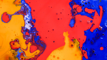Bright colorful multicolored bubbles on the surface of the water. Abstract paint bubbles