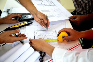 Team work Architectural work site desk background construction project ideas concept, With drawing...