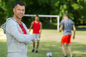 a coach looking at camera