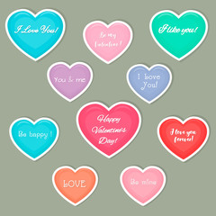 Vercto set of ten hearts multicolored stickers in a white stroke with a text about love. Valentine s Day or wedding for your design. Flat style
