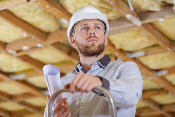 engineer holding plans in hand