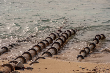 Fototapeta na wymiar Sewer pipes go to sea