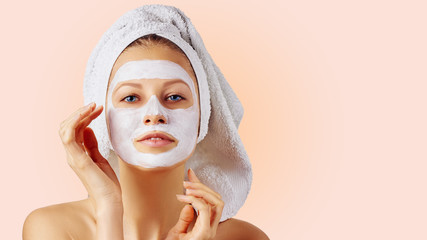 Cosmetology, skin care, face treatment, spa and natural beauty concept. Woman with facial mask.