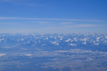 Obraz premium snow-covered German Alps photographed from a plane window