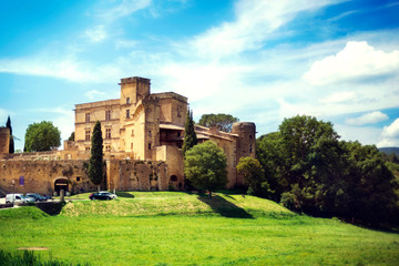 Fototapeta na wymiar Medieval ancient old traditional famous castle Lourmarin chateau in sunny day in Luberon, Provence, France - famous tourist attraction, vacation destination, tourism.