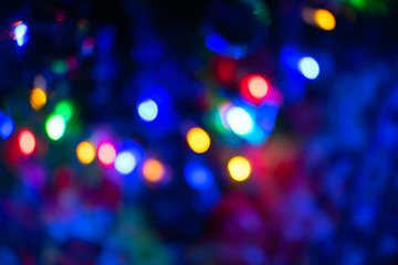 Abstract blur pattern of blue, green, red, yellow lights on isolated black background. Glitter texture christmas abstract backdrop. New Year light.