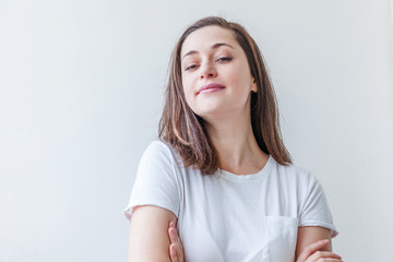 Happy girl smiling. Beauty portrait young happy positive laughing brunette woman on white background isolated. European woman. Positive human emotion facial expression body language