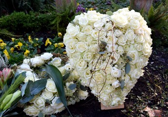 heart shaped white roses cemetery flower arrangement 