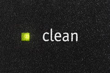 Macro close up photograph of clean indicator light on dishwasher machine. 