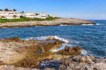 Fototapeta na wymiar Cala Torret - beautiful bay in the southern coast at Binibeca village. Menorca, Spain