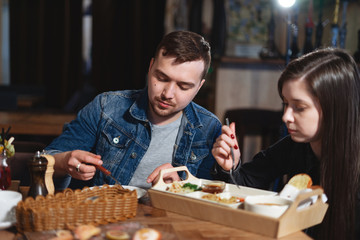 Handsome couple having lunch