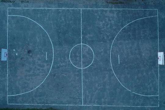  An unusual bird's-eye view of an unevenly painted basketball court