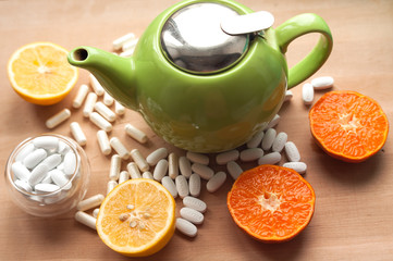 white pills in a chinese glass tea bowl in hand