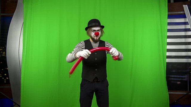 A sketch with a clown. Green screen.