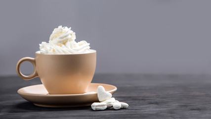 Cup of coffee with decoration -marshmellow, cream, berries