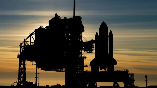 Space Shuttle: Time Lapse at Sunset with Colorful Sky and Spaceship in Silhouette, USA