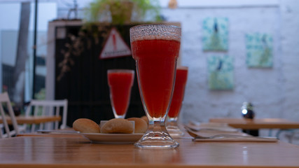 glass of red wine on table in restaurant