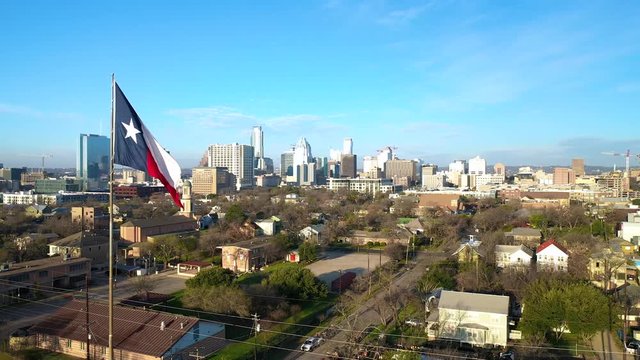 4K Texas Flag Austin Skyline Frost Tower University of Texas Aerial View