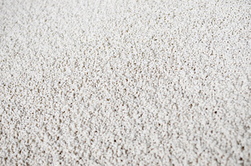 Obraz premium White granulated phosphate fertilizers abstract background. Selective focus.