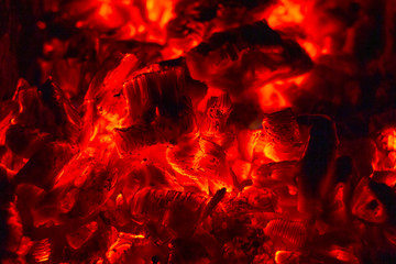 Glowing Hot Charcoal Briquettes Close-up Background Texture