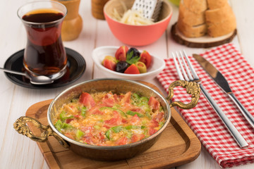 Turkish breakfast with menemen and tea