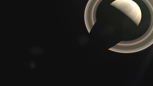 Top view of the planet Saturn with beautiful rings. Rotation of the sun around the gas giant. Solar system, Milky Way galaxy footage. 4K Scientific Space Video