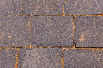 Background image of granite paving slabs.