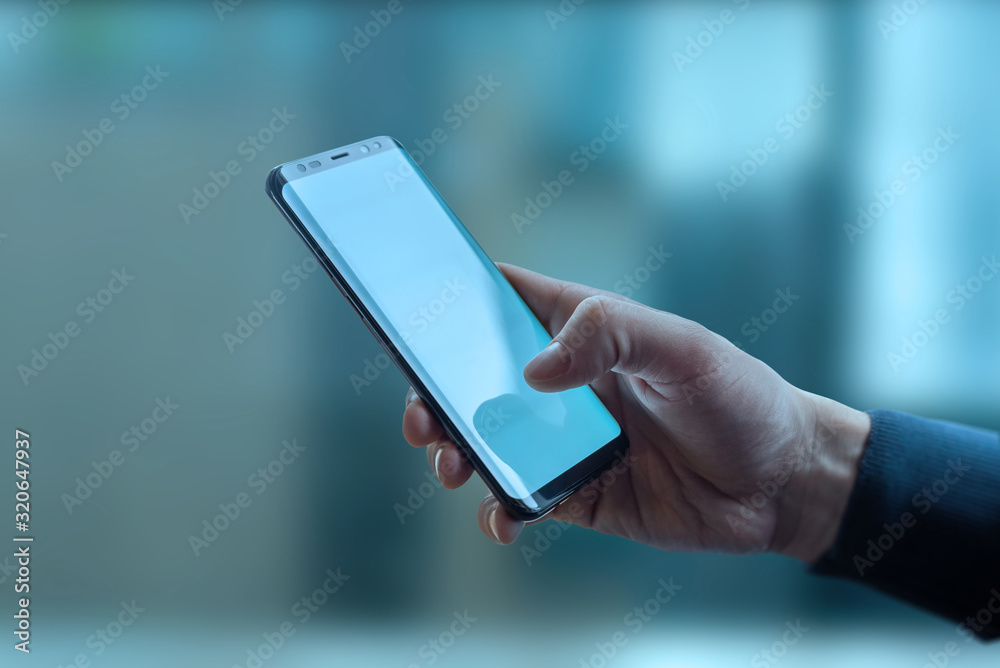 Poster man holding smart phone. close-up scene with abstract tehnology background. global connection concep