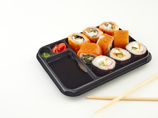 California rolls in a disposable container, fast food.Isolate white background 