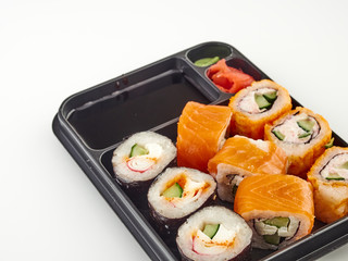 California rolls in a disposable container, fast food.Isolate white background 
