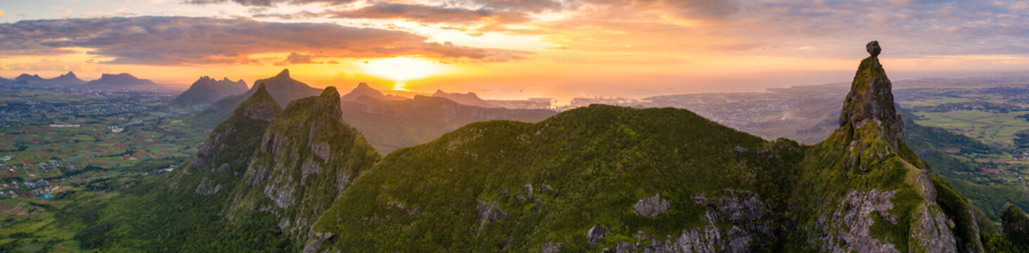 Aerial panoramic of sunset over Le Pouce and Pieter Both mountains, Moka Range, Port Louis, Mauritius