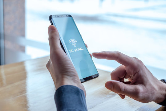 No Wi-Fi Signal Message On Phone Display. Concept Of Intermittent Signal Due To Router Or Mobile Network Error
