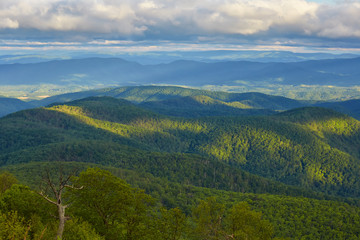 Early morning light illuminates portions of the Blue Ridge and Allegheny mountains near Lexington, Virginia.  Photographed along the Blue Ridge Parkway.