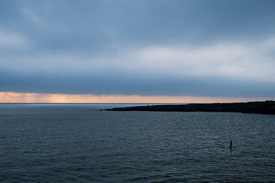 Picture of a seascape during sunset over the Atlantic Ocean, taken during winter.