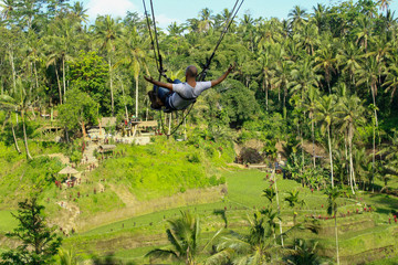 Happiness and freedom. Tegalalang rice terrace swing, Bali, Indonesia