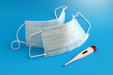 Medical face mask isolated on blue background.