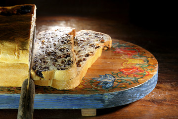 Bremer Klaben, a type of Stollen from Bremen, Germany, on a vintage wooden cutting board