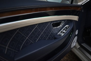 Obraz na płótnie Canvas Luxury car door trims and handle.