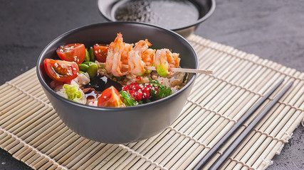 Fried rice with vegetables, beans and shrimp. Asian food. Copy space