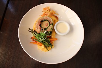 Piece of meatloaf, mashed potatoes and fresh salad on a white plate